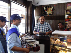 Distribution of paper bags to the shopkeeper of Bistupur